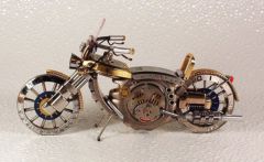 Made out of mechanical wristwatch parts this is kinda cool.
'Steampunk' Art? Or what?!?
