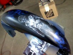myfender, the front fender to my chopper. The artwork is from "Underworld"..... Michael is in the middle, the hybrid. Marcus (vampire elder) is on top and race (lican) is on the bottom.