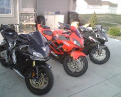 My bike in the middle and my old roommates bikes. (05 CBR 600 RR, & 05 CBR 1000 RR Repsol)