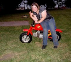 I just wiped out on the mini bike. That divit in the lower left hand corner is all my work. Notice the dirty right pant leg and right shoe. Yeah, rockstar! 8/8/09. Had some H-D riders at the party give me kudos because I got right back up and on again.