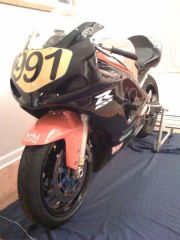 The bike temporarily moved inside due to unforeseen garage heating issues....