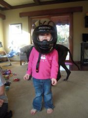 she loves daddy's helmet