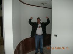 My muscle, Mike, showing off the lovely new curved walls to the bathrooms