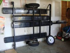 This is how we store the trailer. It has bolt-on stands that go on the ends for support and is held up with heavy duty wire bolted to the wall.